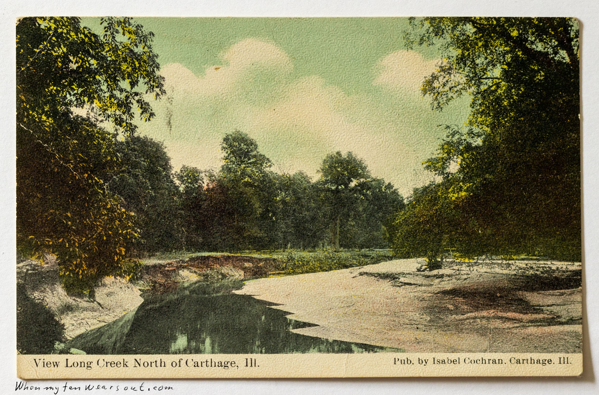 Front of postcard #0068: Colored landscape depiction of a creek, identified as Long Creek, showing trees reflecting in the water on the left and 