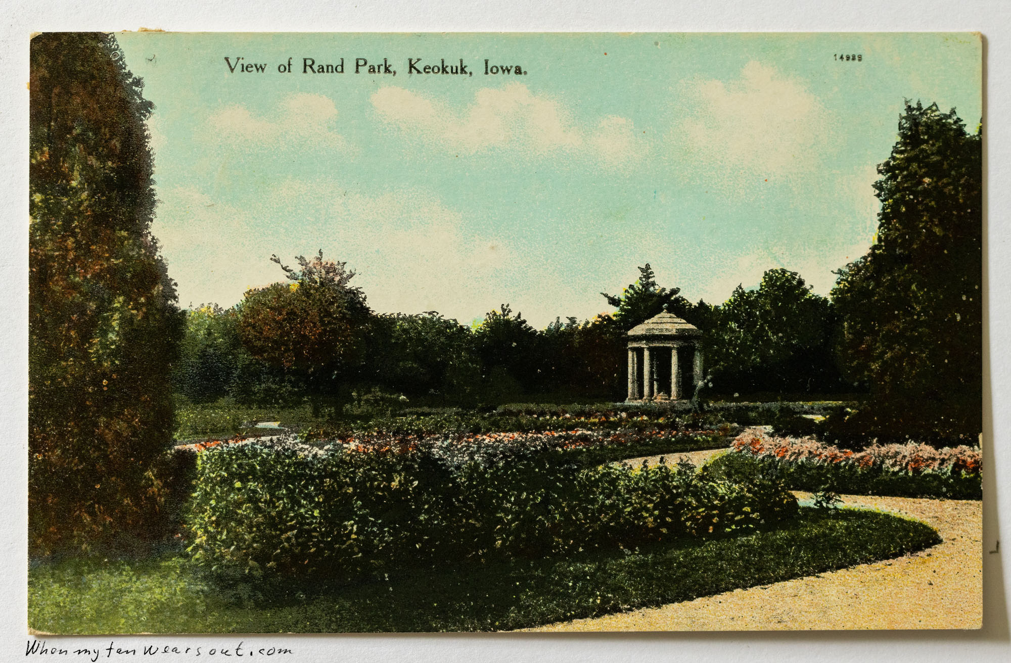 Front of postcard #0088: Color illustration of Rand Park in Keokuk, Iowa, featuring a classical stone monopteros (circular pavilion) surrounded b